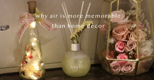 Airy designer reed diffuser styled with luxury home decor, illustrating a sensory strategy for memorable guest hosting and high-end home scenting in a curated British interior.