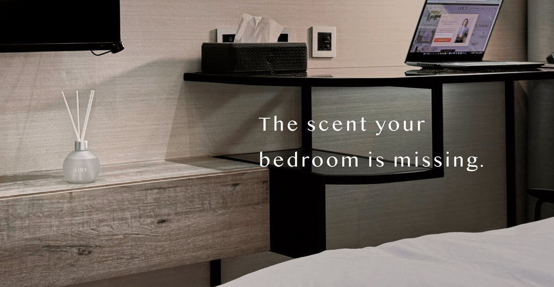 AIRY® Fragrances reed diffuser on a wooden bedside table in a minimal hotel-style bedroom,  luxury Japanese home fragrance by AIRY® Fragrances.