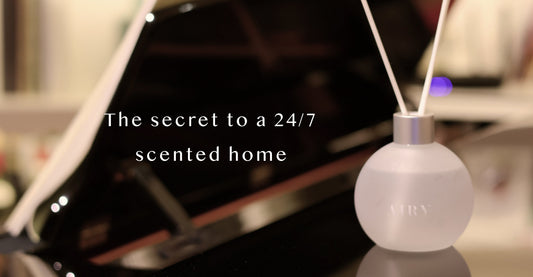Airy alcohol-free reed diffuser illustrating capillary action and precision-engineered scent diffusion for long-lasting perfume-grade home fragrance in a modern interior.