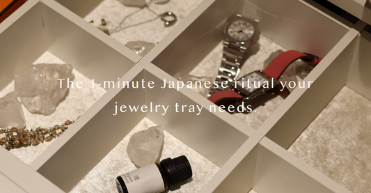 Luxury home fragrance experience featuring AIRY crystal stones and fragrance oil placed in a white partitioned jewelry drawer alongside luxury watches and silver necklaces for a curated Japanese morning ritual.