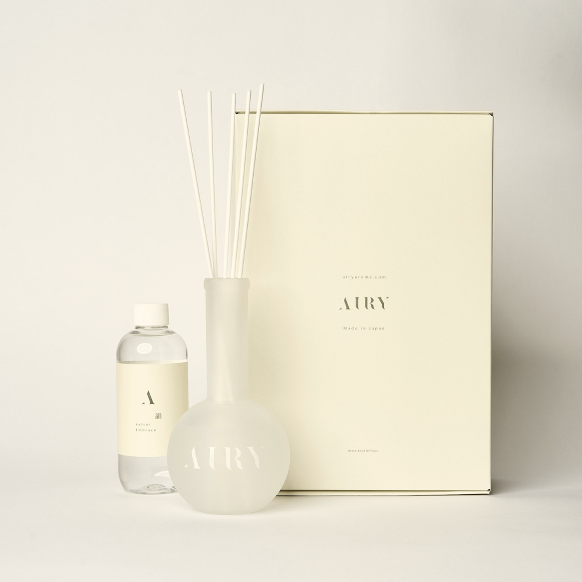 Velvet Embrace 韻 luxury reed diffuser set featuring Okayama Peach and White Jasmine. The image shows the 250ml artisan-crafted fragrance oil, signature frosted glass vessel, and premium white reeds. A poetic, alcohol-free Japanese scent designed for creative flow, studios, and sunlit mornings.