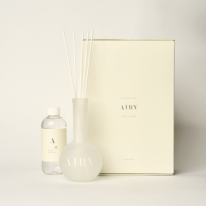 Velvet Embrace 韻 luxury reed diffuser set featuring Okayama Peach and White Jasmine. The image shows the 250ml artisan-crafted fragrance oil, signature frosted glass vessel, and premium white reeds. A poetic, alcohol-free Japanese scent designed for creative flow, studios, and sunlit mornings.